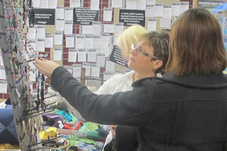 Colleen Ringham, co-ordinator of the continuing education program at Loyalist, and Administrative Co-ordinator for Corporate Training, Madeleine Norman, check out the hand crafted jewelery at the 10,000 villages Fair Trade Sale. The sale is at Loyalist December 7-9, 2011, and promotes fair trade- meaning the creators of these items get their fair share of the revenue.The Fair Trade Sale is organized by Loyalist's International Development students. Coffee, chocolate, artisan cheeses, along with hand-made jewelery, Christmas ornaments, and other knick-knacks are all for sale.Photo by Taylor Renkema.