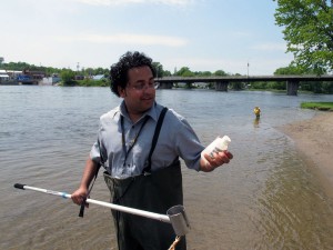 FRANKFORD, ON (30/05/2011) Nandu Latchman, student public health inspector, gathers a water sample from Frankford's water. The sample is put into a cooler and send off to Kingston for analyzes. Photo by Steph Crosier