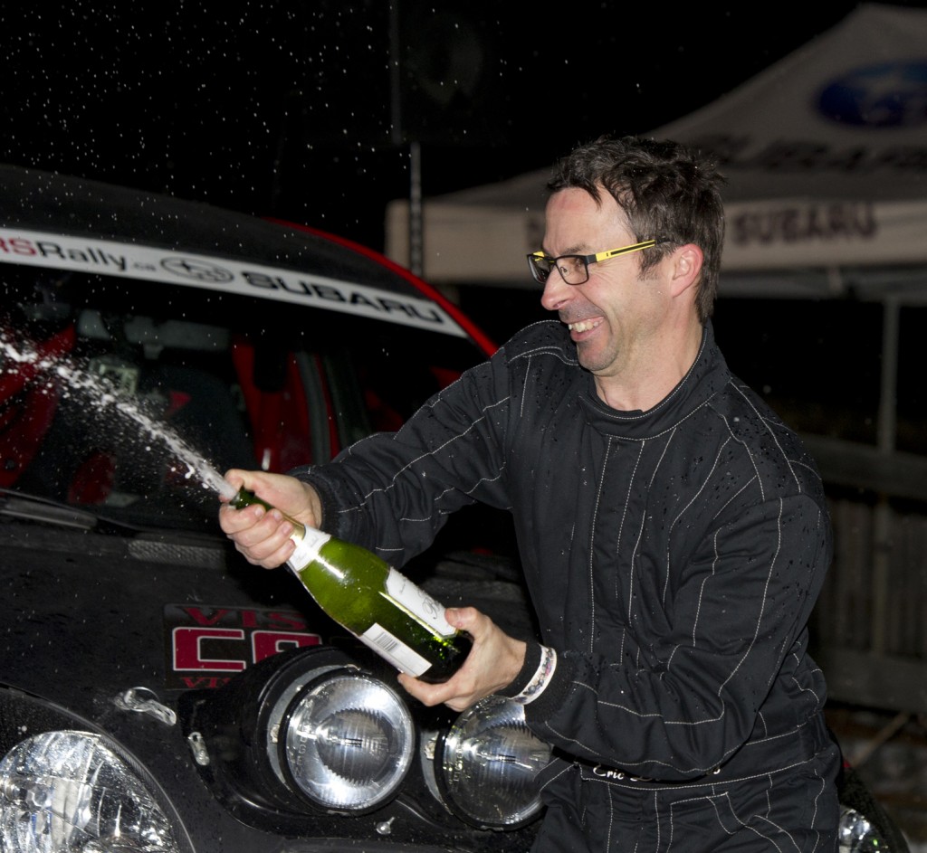 BANCROFT, Ont. [30/11/2013] Eric Deschenes sprays champaigne onto his 2004 Toyota Echo (Yaris V1) during the champaigne shower results ceremony at the 43rd annual Rally of the Tall Pines in Bancroft, Ont. on Saturday, Nov. 30, 2013. Dechenes, with his co-driver Catherine Asselin, placed 11th overall, and second in the National two-wheel production championship. Photo by Kaitlin Abeele