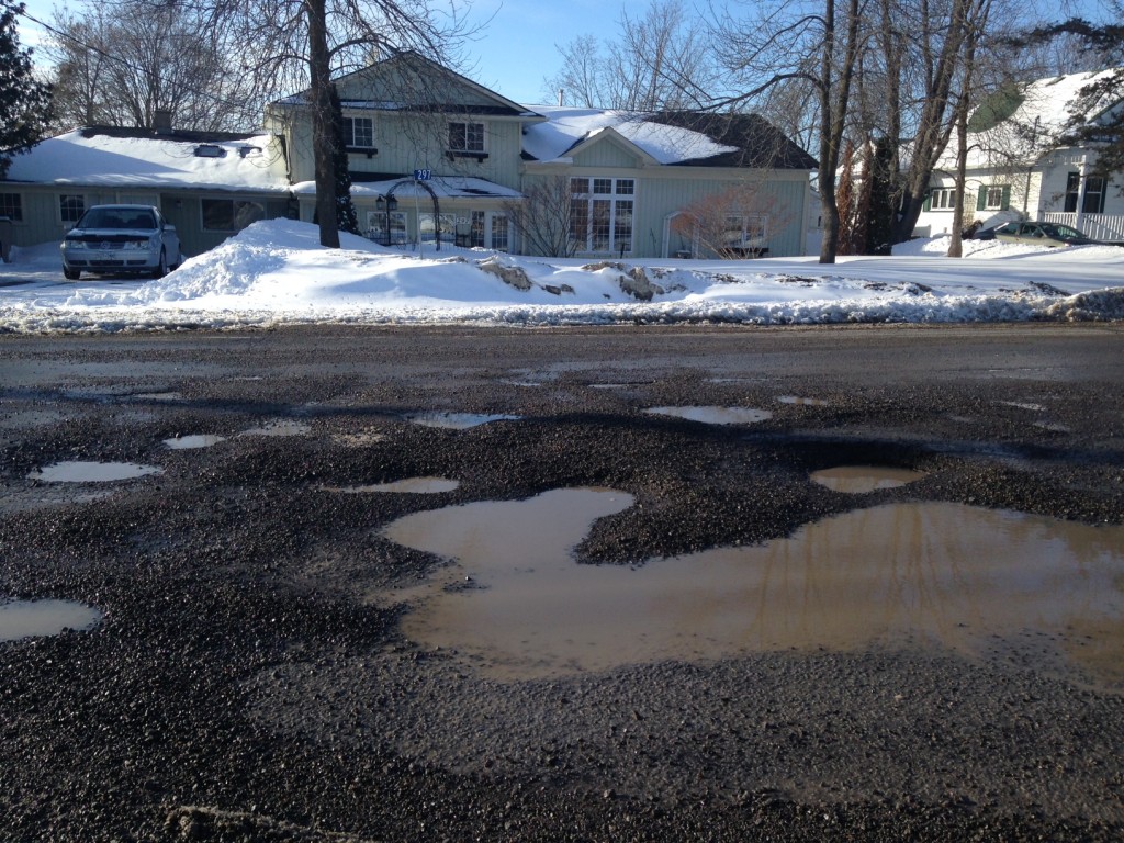 Potholes are a buig problem in Belleville this year. These potholes are at the corner of Tank Farm road and Cannifton Road north of Belleville. Photo by Greg Murphy