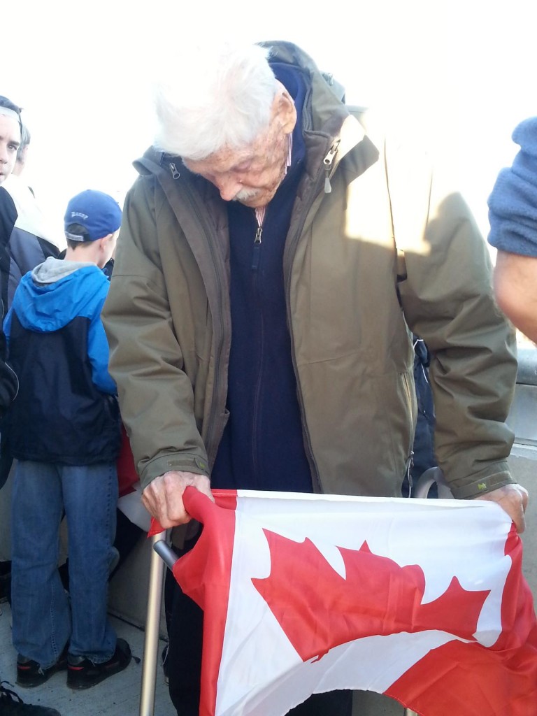 Ed Haddon was given a flag to hold as Cirillo's body passed by the Glen Miller overpass Photo by Taylor Broderick