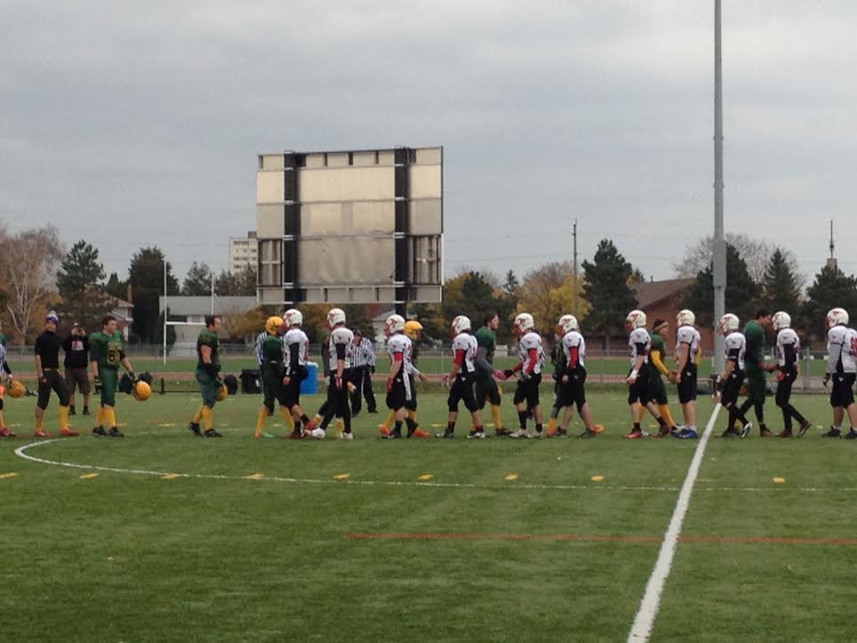 Members of both teams shake hands at the end of the game.
