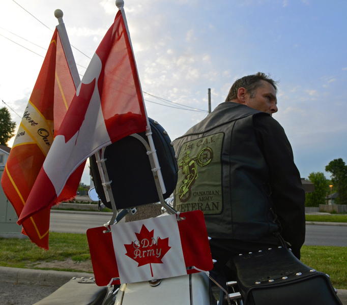 TRENTON ONT (27/06/2011) For Lance Usher flying the Canadian flag is important because he served under it for 24 years. Usher is now retired and still supports the military by participating in the 1st Canadian Army Veteran motorcycle group events. One of the events the group takes part in is any repatriation ceremonies. Currently his son is serving in the Canadian military making him 4th generation in the Usher family to serve. Photo by Linda Horn