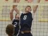 Lancer veteran Jared Moelker reaches to block the ball during a game against Fleming. Photo by Taylor Renkema.