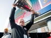 1:54 p.m. Former Ottawa Rough Rider Russ Jackson raises the Grey Cup as he brings the trophy into the University of Toronto's Varsity Stadium before the start of the inaugural fan parade. Photo by Justin Tang