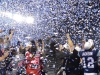 TORONTO, Ont. (25/11/2012) â The Argonauts celebrate their 100th Grey Cup win on top of a stage as blue and white confetti falls at the Rogers Centre, Sun., Nov. 25, 2012.  Photographers and reporters rush the stage to get as many photos as possible and interview the players.  The Argonauts took on the Calgary Stampeders winning 35-22.  Photo by Alicia Wynter