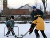 BELLEVILLE, Ont. (12/02/12) - Christopher Doyle, 9, lines up a shot against his brother Jonathan, 7, and dad Jim on a patch of frozen harbour near downtown Belleville on Sunday, Feb. 12, 2012. The Doyles were some of dozens taking in an outdoor skate on smooth ice this weekend. Photo by Rachel Psutka.