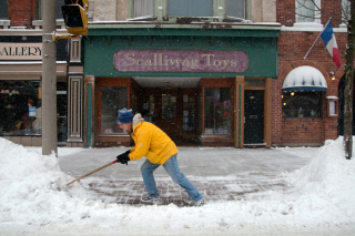 BELLEVILLE, ON (1/13/2012) â Richard Belanger clears an entrance to his store, Scallywag Toys, in Belleville friday afternoon. Snow flurries delivered ten centimetres of snow, requiring many storefront owners to hit the streets with their shovels. Belanger enjoys this weather, "It's the time of year we're supposed to have snow!" (Photo by Mark Tarnovetsky)