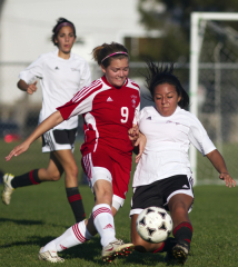 KINGSTON, Ont. (22/09/11) - Loyalist Lancer Stephanie Turk (9) struggles with her opponent from St Lawrence College in Kingston on Thursday, Sept. 22, 2011. The Lancers held a strong lead until the last 15 minutes of the game, where a goal by St Lawrence led to a 1-1 final score. College athletics is now back in action following the return of the support staff. Photo by Rachel Psutka.