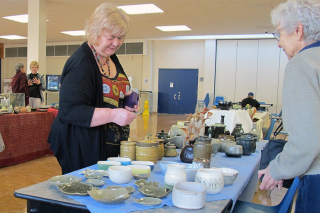 BELLEVILLE (22/11/12) Loyalist College's Continuing Education students are hosting the fall Pottery Sale in the cafeteria. Cathy Hall, from the financial aid office, bought a leaf and two dishes. They are Christmas gifts for othersâ¦ and herself. Photo by Steph Crosier