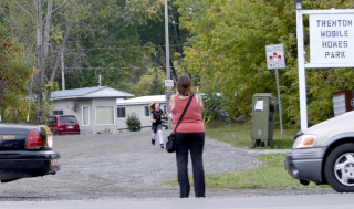 TRENTON ONT (28/09/2011) Billie Jo McNaughton waits to reunite with her daughter after police close all access to the Trenton mobile park. Det. Sgt. Brad Robson said the OPP were investigating a home invasion and minor assault. The park was closed for two hours while OPP officers on the ground and OPP helicopter searched for suspects. No suspects were found. The victim suffered minor injuries. Photo by Linda Horn