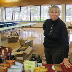 Christine Hammond is a volunteer with 10,000 Villages, who is selling jewlery, coffee, chocolates and small knick-knacks to raise money for Friends of Migrant Workers of Brighton. Photo by Mike Morris.