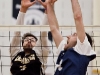 BELLEVILLE, Ont. (14/01/12) â Chris Holden (L) of the Cambrian Golden Shield attempt tries to block the volley of Matt Woods (R) of the Loyalist Lancers during the men's volleyball game against the Loyalist Lancers held at Loyalist College in Belleville, Jan. 14, 2012. The Lancers defeated the Golden Shield 3-0. Photo by Melchizedek Maquiso.