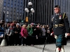 TORONTO, Ont. (11/11/11) - A veteran walks past a group of school children on his way towards the cenotaph. Thousands of people gather at the intersection of Bay Street and Queen Street at the cenotaph in front of Torontoâs Old City Hall to pay their respects to past and present Canadian veterans. Photo by Sarah Swenson.
