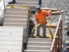 BELLEVILLE, Ont. (09/07/2012) A construction worker on the grounds of the Quinte Consolidated Courthouse rigs up stairs to be lifted into the building. Photo by Marc Venema.