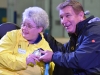 Karen Kitchen and Rick Hansen smile for the cameras with the relay medal on stage at the Quinte Sports Center.
Photo by Taylor Renkema