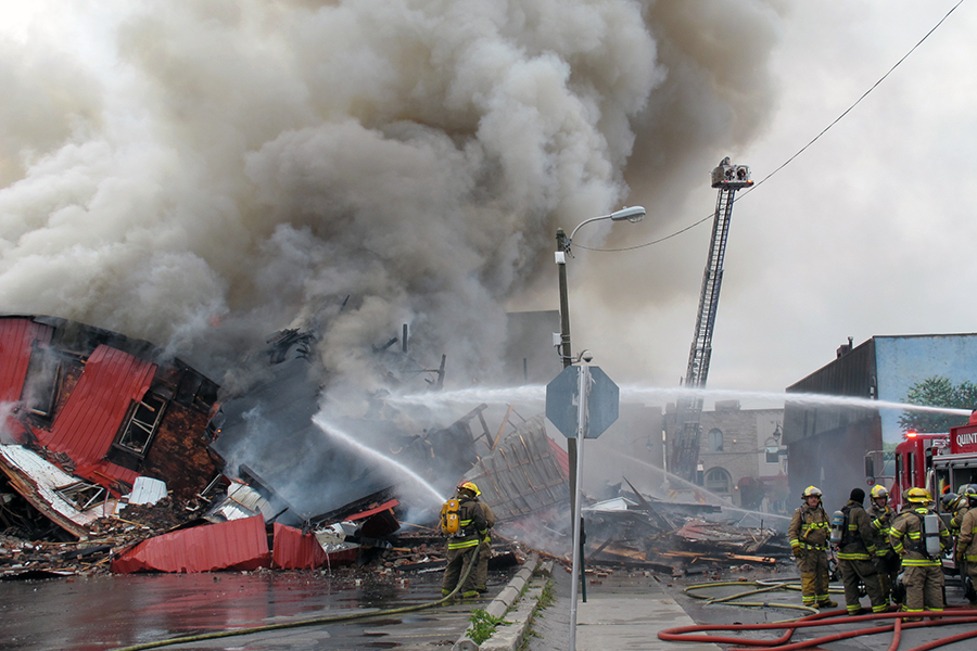 (TRENTON-11/05/2012) Firefighters battle a blaze at the Sherwood Forest Inn on Monday morning. The building at 19 Murphy Street went up in flames after 9 a.m. Downtown Trenton was blocked off by police and smoke could be seen from Belleville. Photo by Marc Venema.