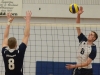 Lancer Jared Moelker spikes the ball past George Brown. Loyalist lost 3-1 to the Huskies. Photo by Taylor Renkema.