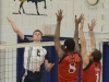 Lancer Jared Moelker looks to spike the ball past Seneca's Jordan Darlignton (8) and Vladyslav Danyliuk (1). Photo by Taylor Renkema.