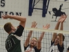 Lancers Lucas Yakabuski and Jared Moelker reach to block a spike from Fleming. Photo by Taylor Renkema.