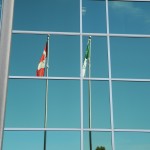 Franco-Ontarian flag hangs beside the Canadian flag