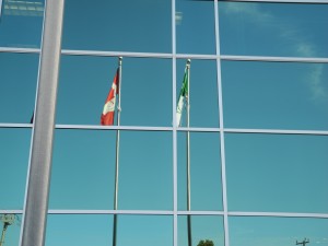 Franco-Ontarian flag hangs beside the Canadian flag